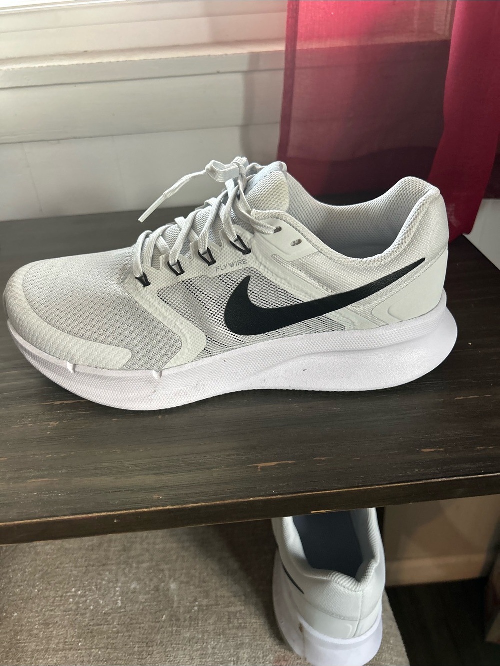 Nike Men’s White Athletic Shoes with Black Swoosh